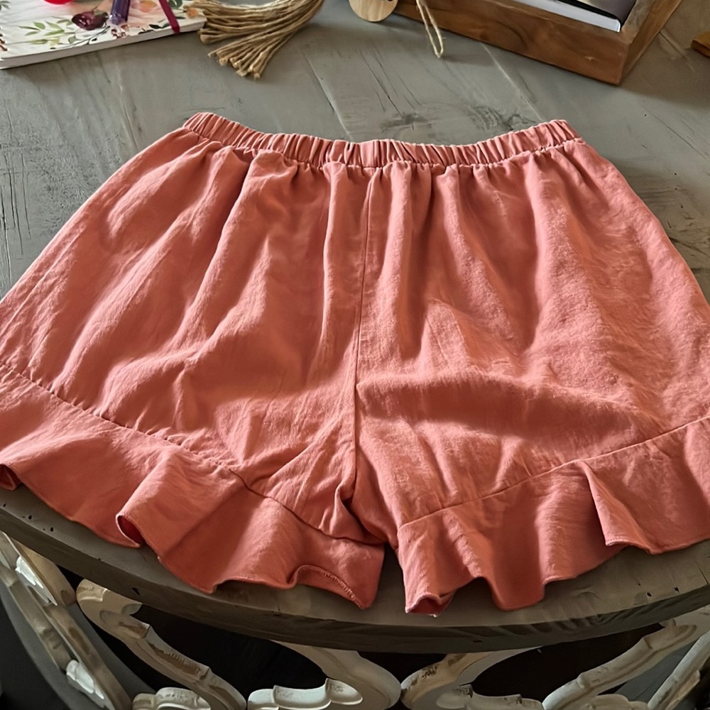 Coral shorts with ruffle hem